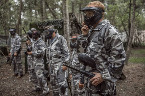 istock A paintball team during a game in a forest 1420182048