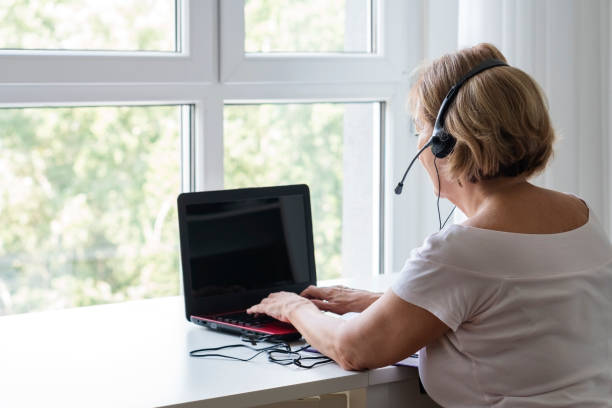 istock Senior woman online learning 1420185767
