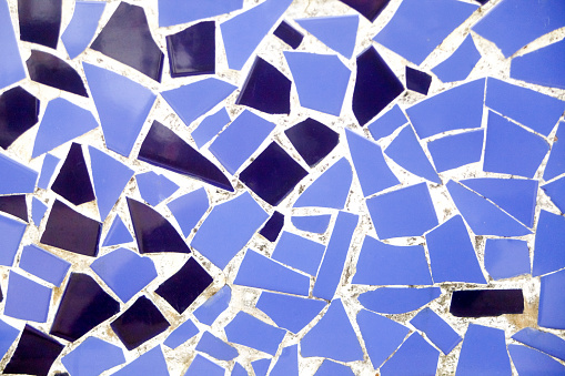 Broken tiles blue broken tiles pattern, wall or flooring decoration . Traditional trencadis decoration, construction, , full frame view. Spain.