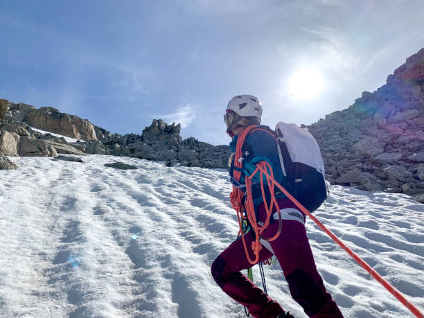 istock Climbing rope leads to female mountain guide on glacier 1420188609