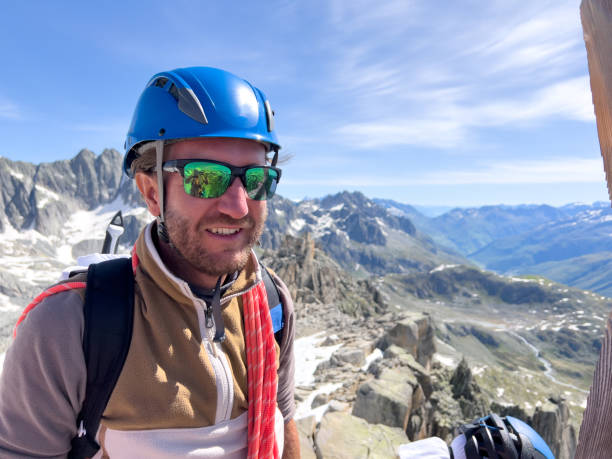 istock Happy mountaineer on mountain summit 1420189117