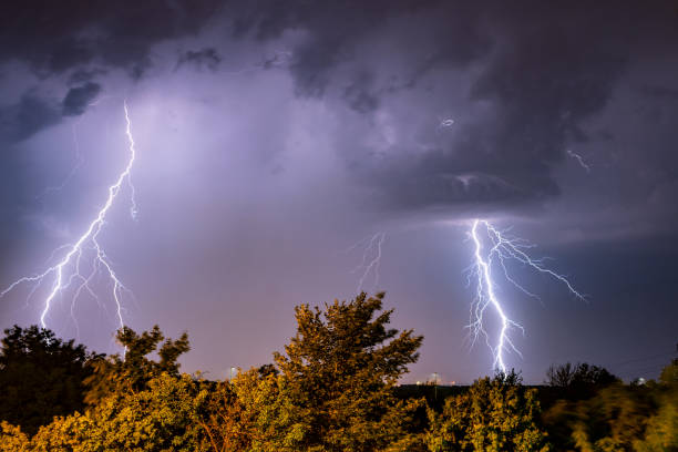 Real flashes of lightning during a thunderstorm A powerful storm forming late in the afternoon. Climate change photo. military attack photos stock pictures, royalty-free photos & images