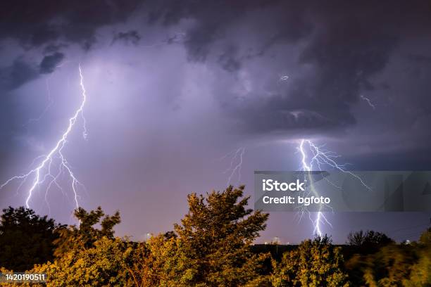 Real Flashes Of Lightning During A Thunderstorm Stock Photo - Download Image Now - Lightning, Air Attack, Accidents and Disasters