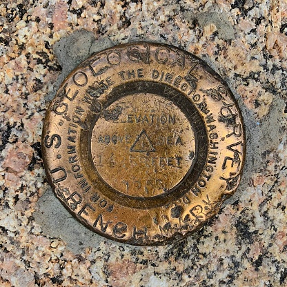 The United States Geological Survey Marker at the top of the Tooth of Time, located in Philmont Scout Ranch, New Mexico.