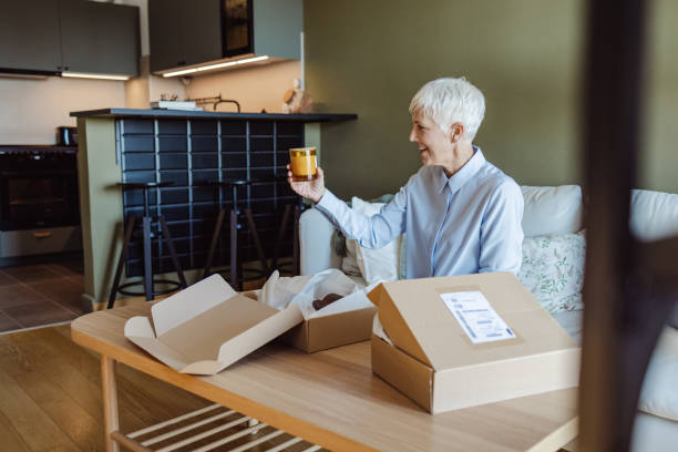 istock Senior woman received order from an online store 1420191297