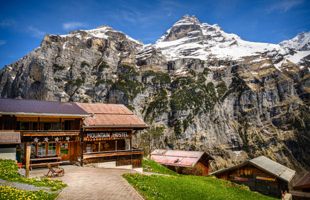 The small mountain hostel in Swiss Alps Gimmelwald, Switzerland - May 09, 2021. The small mountain hostel in the Gimmelwald village in region of Bernese Oberland of the canton Bern jungfrau stock pictures, royalty-free photos & images