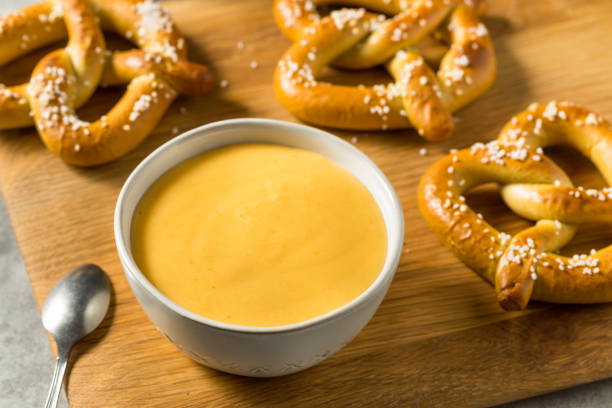 Homemade Beer Cheese Dip Homemade Beer Cheese Dip with Pretzels in a Bowl cheese dip stock pictures, royalty-free photos & images