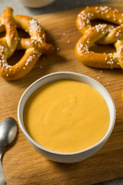 Homemade Beer Cheese Dip Homemade Beer Cheese Dip with Pretzels in a Bowl cheese dip stock pictures, royalty-free photos & images