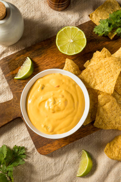istock Homemade Yellow Queso Cheese Dip with Tortilla Chips 1420203848