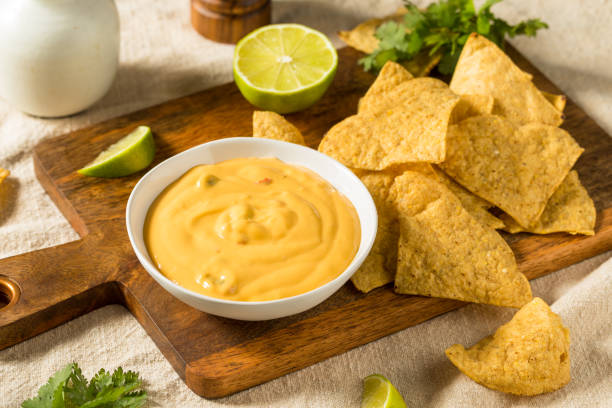 Homemade Yellow Queso Cheese Dip with Tortilla Chips stock photo