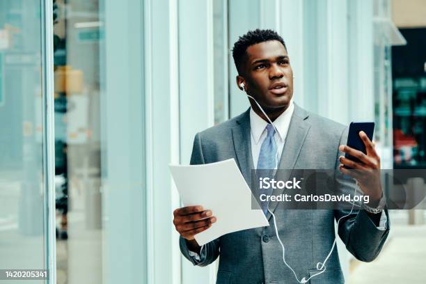 Young Entrepreneur Using Smartphone Outside Wearing Suit Stock Photo - Download Image Now