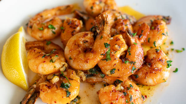 Pan fried butter garlic shrimp on plate stock photo