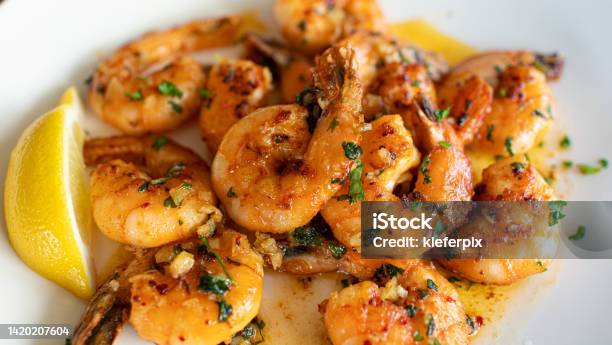 Pan Fried Butter Garlic Shrimp On Plate Stock Photo - Download Image Now - Shrimp - Seafood, Garlic, Prawn - Seafood