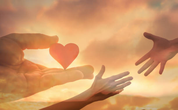 istock Giving love and help to someone in need. Helping hands. 1420208571