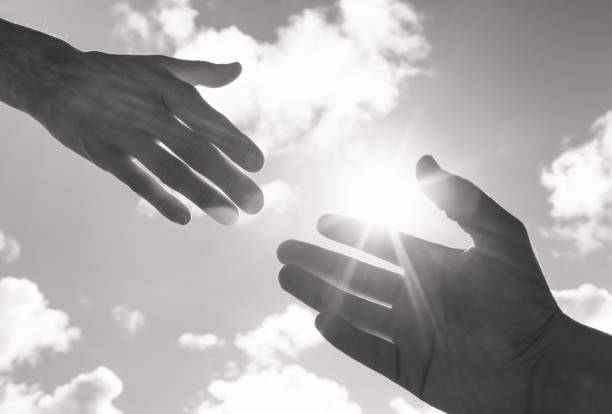 istock Person reaching out giving a helping hand 1420208764