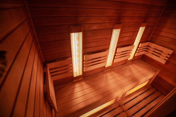 Modern infrared sauna in a wellness studio Modern infrared sauna in wellness studio sauna stock pictures, royalty-free photos & images