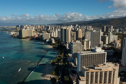 Drone, aerial view of downtown Honolulu with Waikiki Beach during sunrise