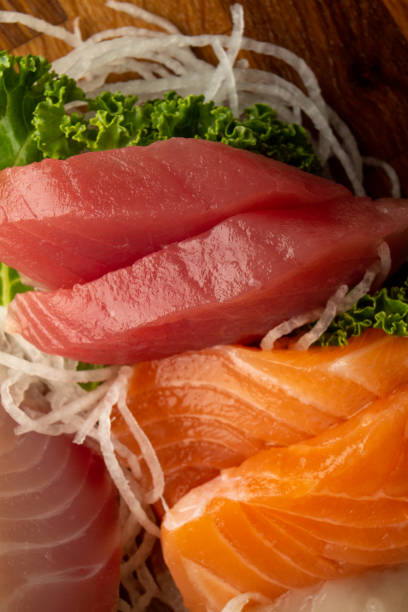 istock Tuna and Salmon Sashimi on cutting board. 1420215041