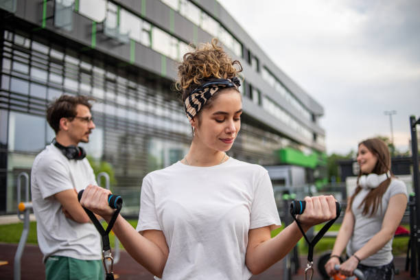 istock A young female athlete uses a resistance band while exercising outdoors 1420218885