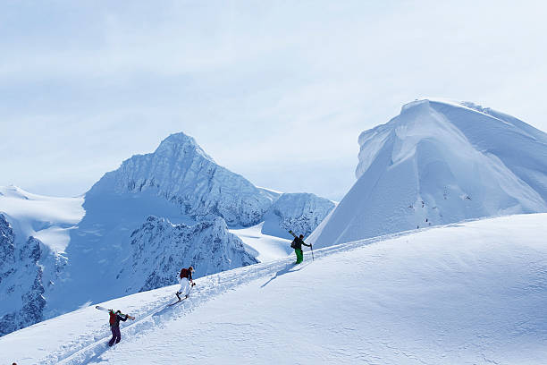 Skiers climbing snowy slope  mt baker stock pictures, royalty-free photos & images