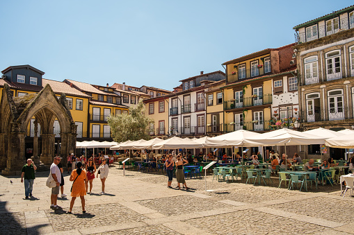 Geres, Portugal; August 31, 2022: General view of the olive tree square in guimarães with several tourists