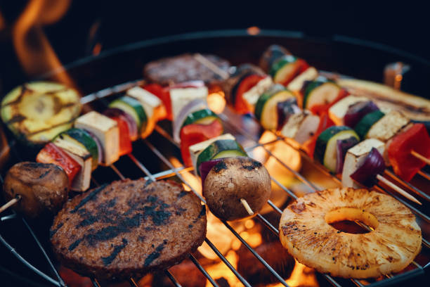 Vegan Skewers and Vegan Burger Patties and Vegetables for BBQ Grill stock photo