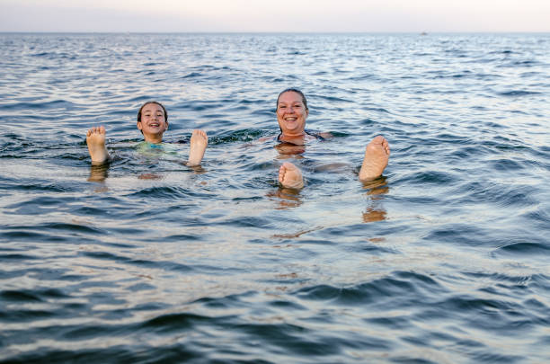 istock Mother and daughter in the Atlantic Ocean 1420225870