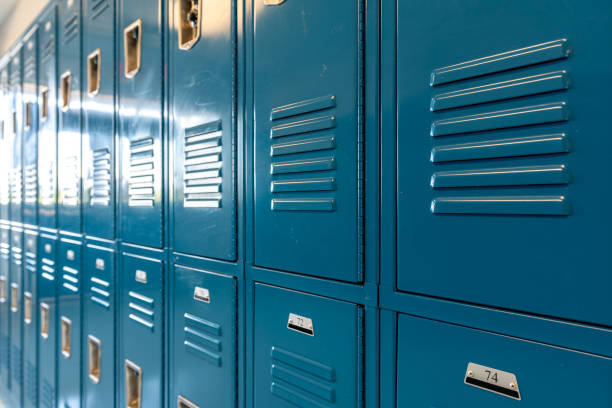 istock Blue metal lockers along a nondescript hallway in a typical US High School.  No identifiable information included and nobody in the hall. 1420229005