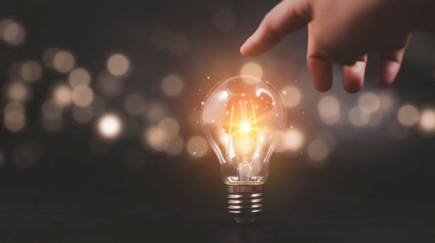 istock Thinking and creative concept, Hand touch light bulb style bokeh vintage dark background,Concept The idea of reading books, knowledge, and searching for new ideas. 1420230081