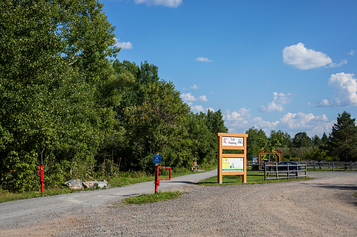 Tatamagouche, Canada - August 21, 2022. Parking lot and signage beside the Trans-Canada trail as it passes through the small town of Tatamagouche, Nova Scotia.