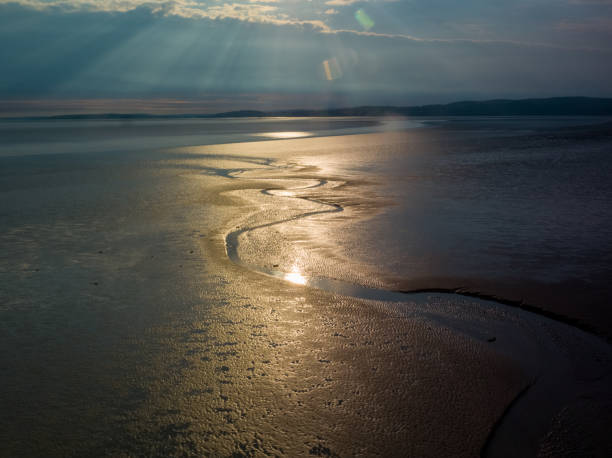 A drone aerial shot of the sunset over Silverdale A drone aerial shot of the sunset over Silverdale in Silverdale, England, United Kingdom morecombe bay photos stock pictures, royalty-free photos & images