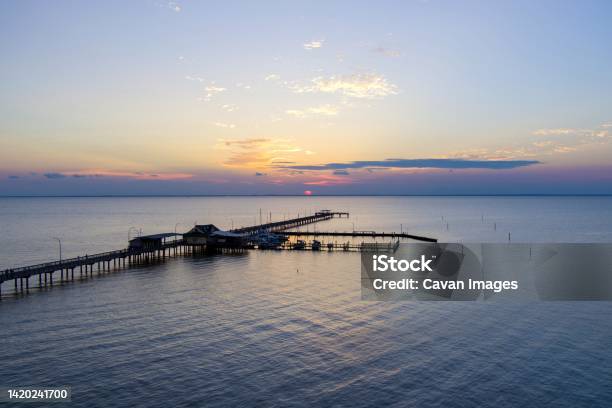 The Fairhope Alabama Municipal Pier At Sunset Stock Photo - Download Image Now - Alabama - US State, Lake, Mobile - Alabama