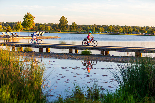 A group of bicyclist rides along Patriot Lake in Shelby Farms Park, Memphis, TN. On Aug. 31, 2022.