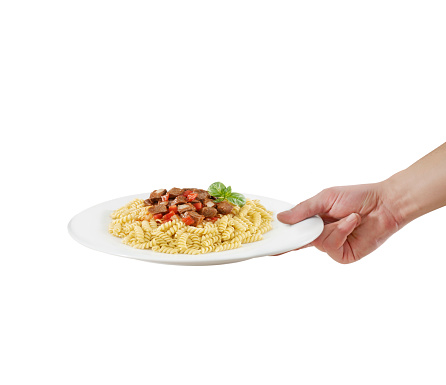 Waiter serving pasta with meat sauce