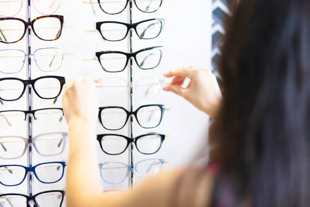 Taking a pair of glasses off the shelf