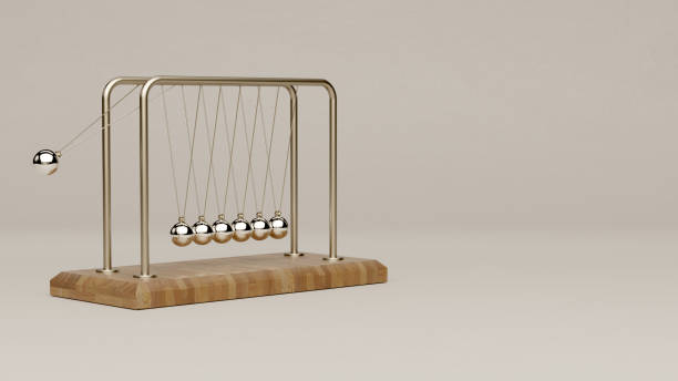 Realistic 3D Rendered Newton Cradle Over Neutral Background Swinging stylized Newton's cradle over neutral background. desk toy stock pictures, royalty-free photos & images