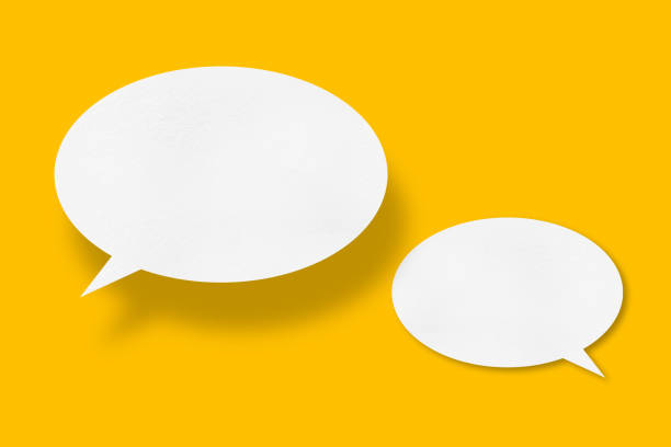 istock White paper in speech bubble shape set against yellow background. 1420267297