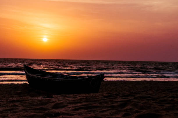 Marvelous beach,with beautiful fishing boat during sunset.