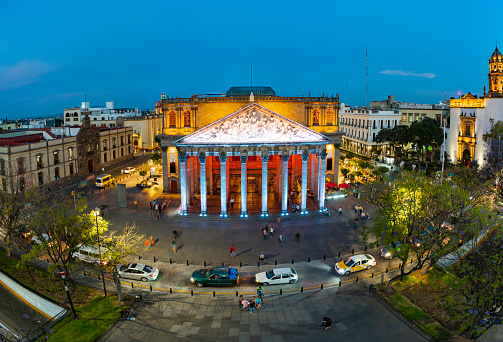 Guadalajara, Mexico - March 15, 2020: aerial footage in the center of the city of Jalisco with huge classic buildings and old churches such as the Parroquia El Sagrario Metropolitano and the Degollado Theater on a beautiful morning