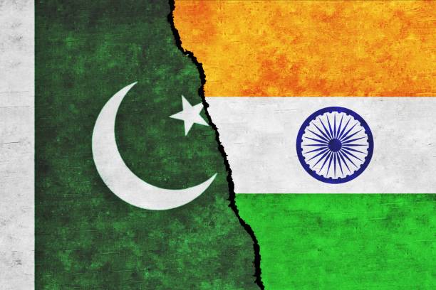 istock India and Pakistan painted flags on a wall with a crack 1420283798