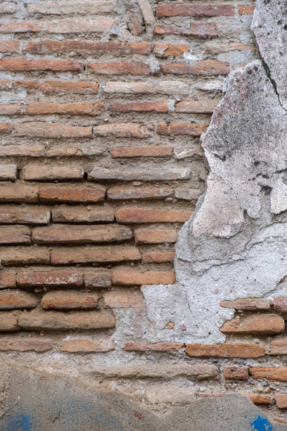 istock concrete plaster is worn out. old brick wall. 1420300789