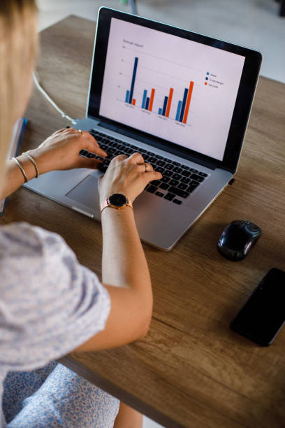 istock Businesswoman typing data and making a graph for a project report on laptop 1420307280