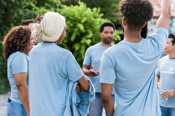 istock Young adults gather to help volunteer 1420307993