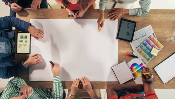 Group of diverse entrepreneurs making a business plan