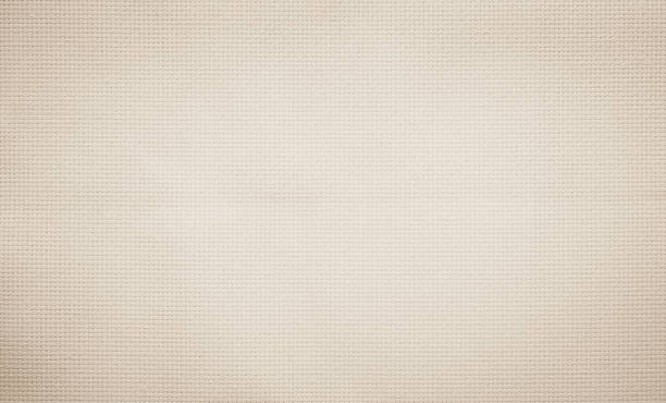 Fabric canvas woven texture background in pattern in light beige cream brown color blank. Natural gauze linen, carpet wool and cotton cloth textile as sack material clean empty for decoration text.