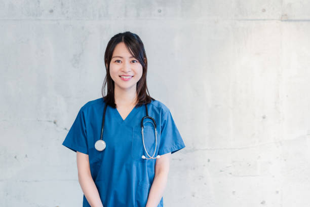 A female doctor smiling in her uniform stock photo