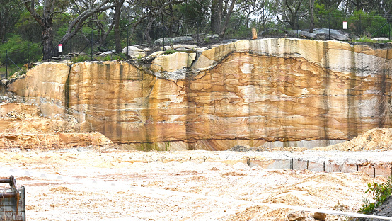 Freshly cut rock face in a sandstone quarry