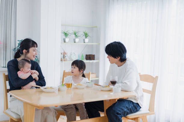 istock A happy family eating dinner together 1420320292