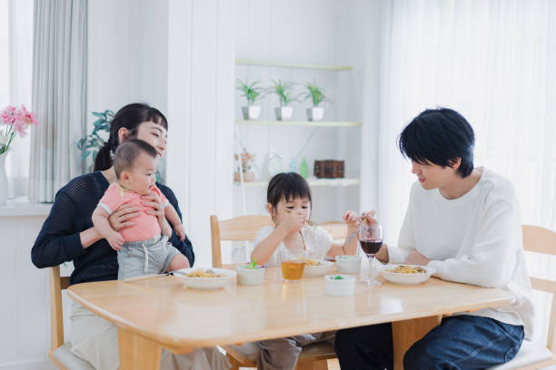 istock A happy family eating dinner together 1420320294