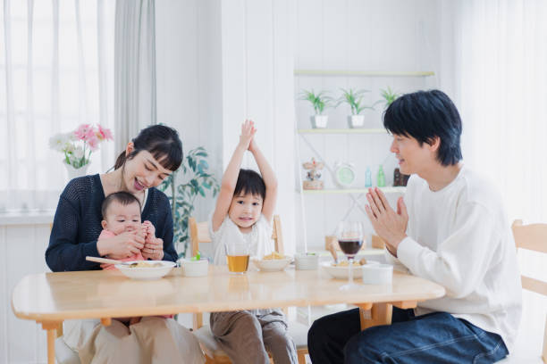 istock A happy family eating dinner together 1420320318
